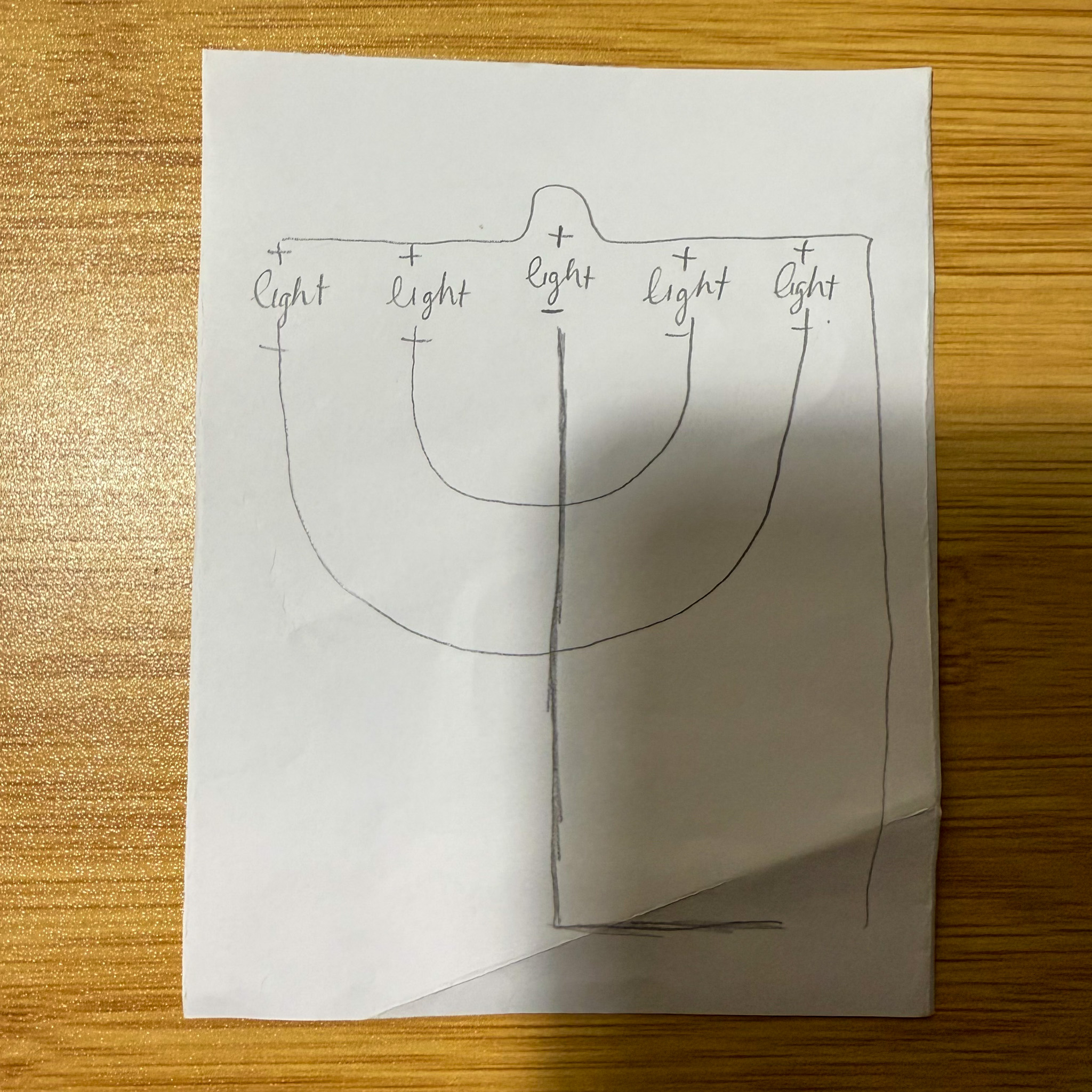 Sketching out the circuit outline. In this case, I wanted to try to make the circuit of the shape Hanukkah menorah.