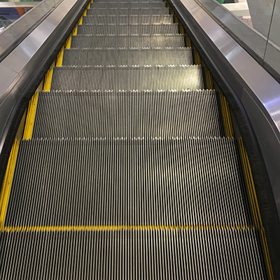 The audio features the steady mechanical hum and clanking of an escalator in motion.