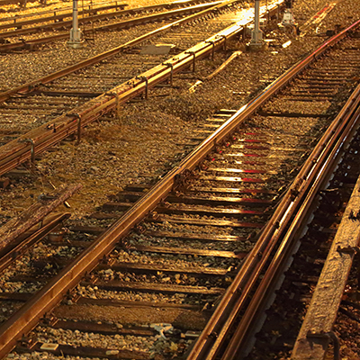 The clattering and deep rumble of a subway train running along the tracks.